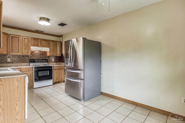 kitchen featuring light tile patterned floors, decorative backsplash, a textured ceiling, electric stove, and stainless steel fridge with ice dispenser