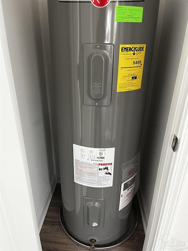 utility room featuring water heater