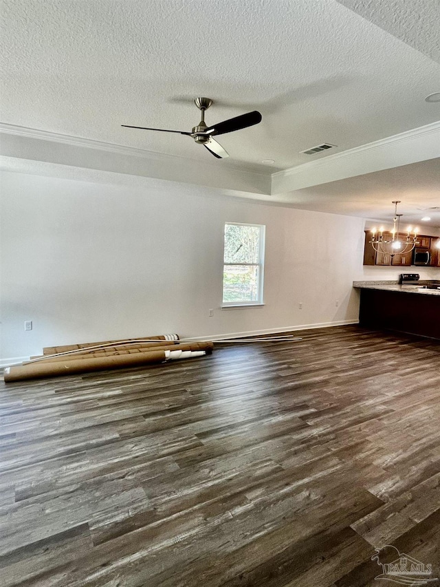 interior space with dark wood finished floors, visible vents, ceiling fan with notable chandelier, and baseboards