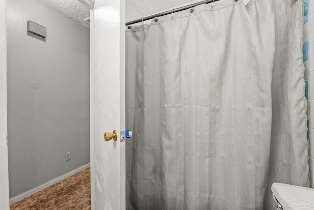 bathroom featuring a textured ceiling