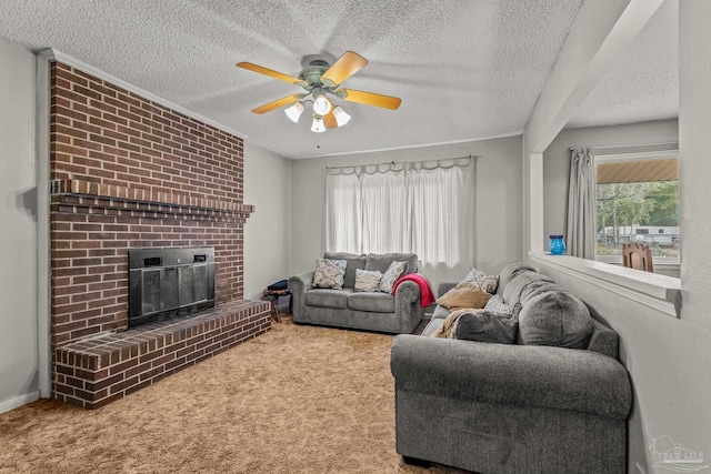 carpeted living room featuring a brick fireplace, a textured ceiling, and ceiling fan