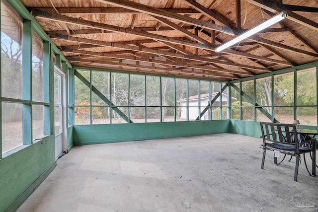 unfurnished sunroom with vaulted ceiling