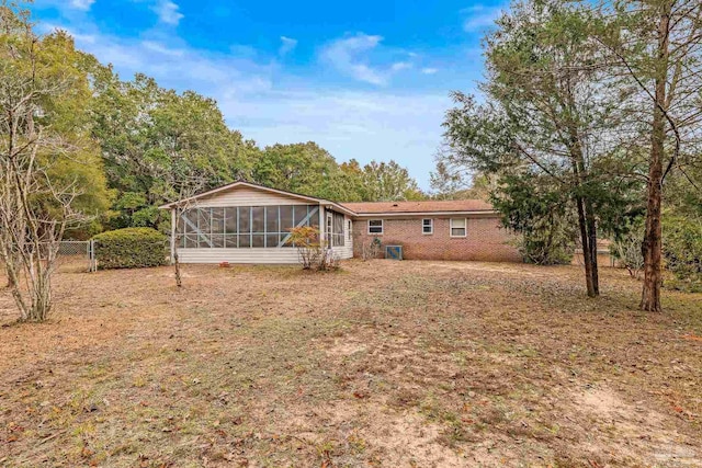 rear view of house with a sunroom