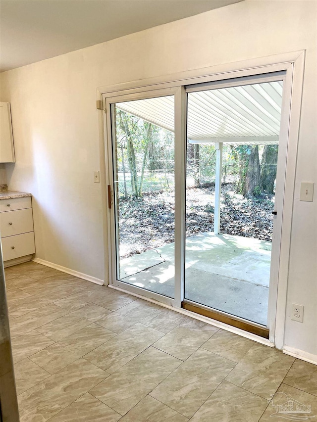 doorway with baseboards