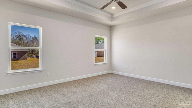 8616 Bluebell St, Milton, FL 32583 - empty room with carpet floors, a tray ceiling, ornamental molding, baseboards, and a ceiling fan