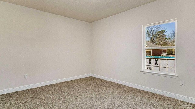 8616 Bluebell St, Milton, FL 32583 - spare room with carpet and baseboards
