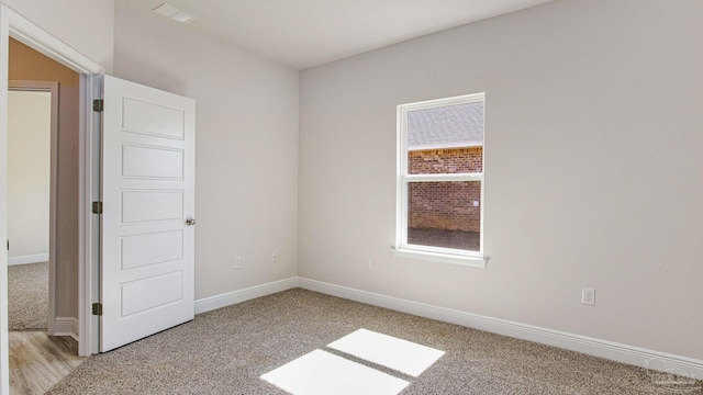 8616 Bluebell St, Milton, FL 32583 - unfurnished room with light colored carpet and baseboards