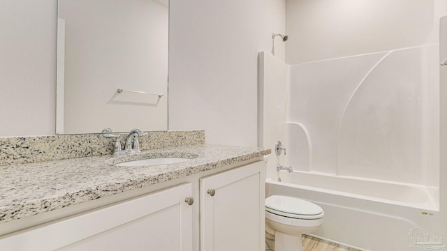 8616 Bluebell St, Milton, FL 32583 - bathroom featuring toilet, vanity, and shower / tub combination