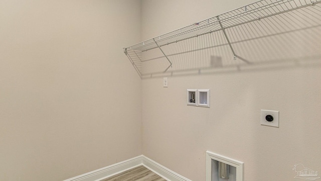 8616 Bluebell St, Milton, FL 32583 - washroom with hookup for a washing machine, electric dryer hookup, baseboards, and wood finished floors
