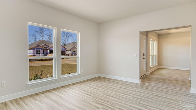 8616 Bluebell St, Milton, FL 32583 - spare room featuring light wood-type flooring and baseboards