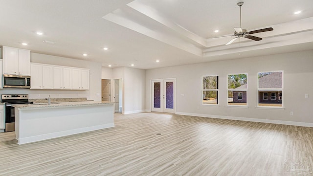 8616 Bluebell St, Milton, FL 32583 - kitchen with stainless steel appliances, recessed lighting, light wood finished floors, a sink, and ceiling fan