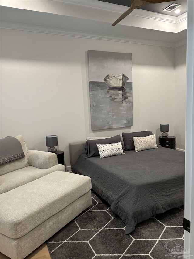 bedroom with visible vents and ornamental molding