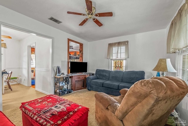 living room featuring ceiling fan