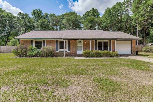6845 Trail Ride S, Milton, FL 32570 - single story home with covered porch, a garage, brick siding, and concrete driveway