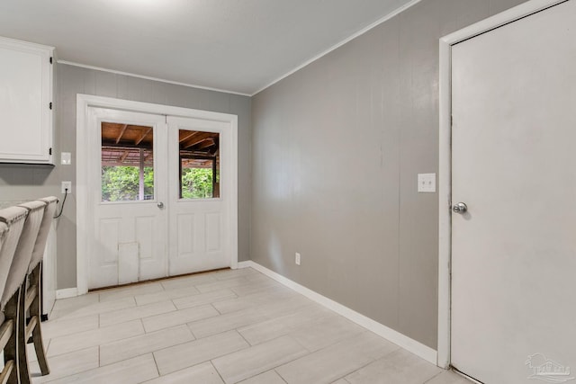 6845 Trail Ride S, Milton, FL 32570 - doorway featuring crown molding and baseboards