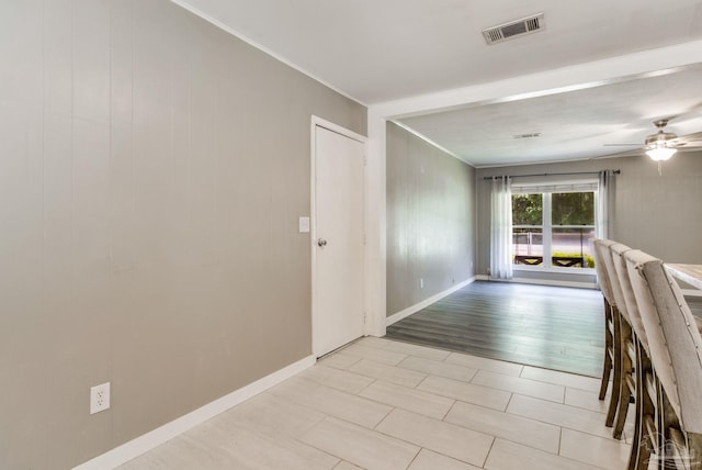 6845 Trail Ride S, Milton, FL 32570 - corridor with ornamental molding, light tile patterned floors, and baseboards