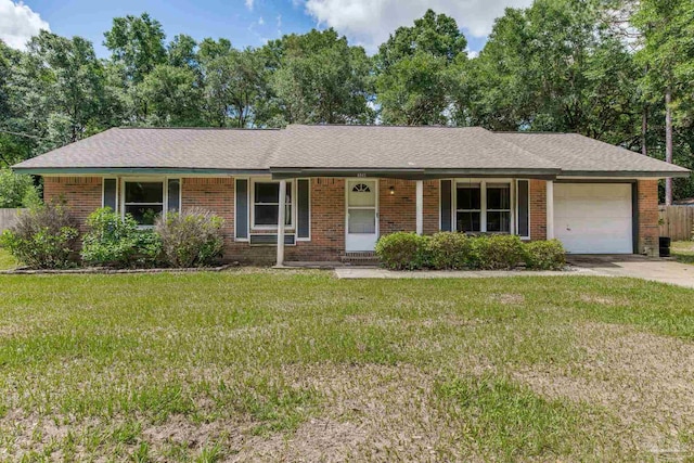 6845 Trail Ride S, Milton, FL 32570 - ranch-style home featuring a garage, a porch, a front yard, and brick siding