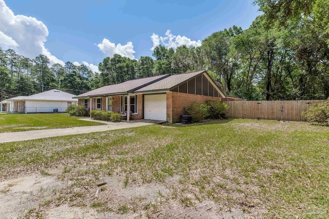 6845 Trail Ride S, Milton, FL 32570 - view of front facade featuring a garage and brick siding