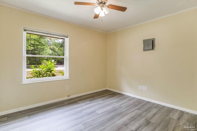 6845 Trail Ride S, Milton, FL 32570 - unfurnished room with wood finished floors, crown molding, ceiling fan, electric panel, and baseboards