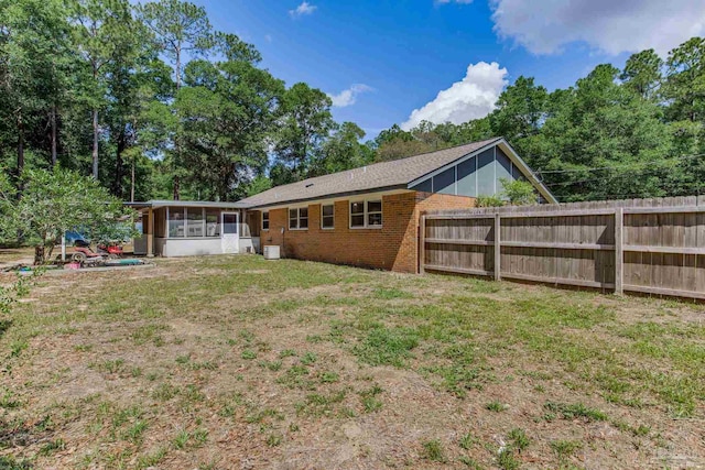 6845 Trail Ride S, Milton, FL 32570 - back of property featuring a sunroom and brick siding