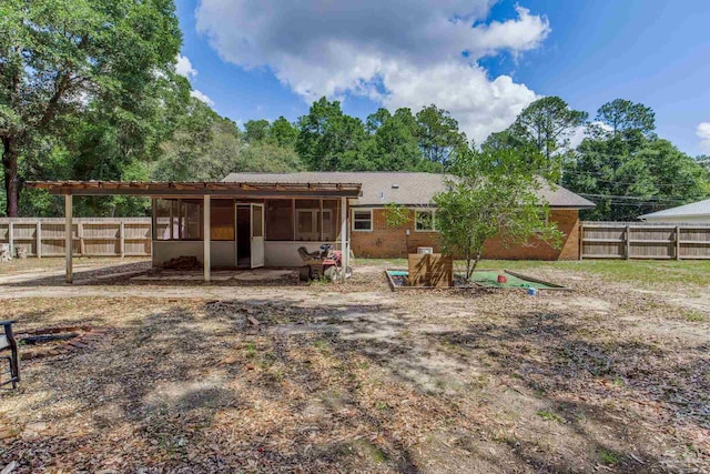 6845 Trail Ride S, Milton, FL 32570 - rear view of property with a sunroom and a fenced backyard