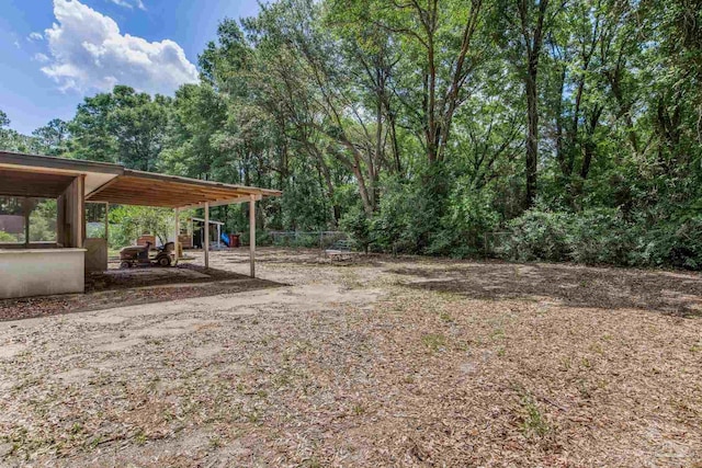 6845 Trail Ride S, Milton, FL 32570 - view of yard featuring a carport