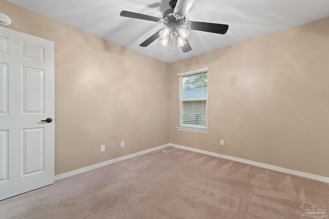 spare room featuring baseboards, carpet, and ceiling fan