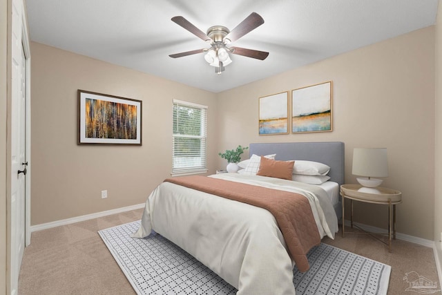 carpeted bedroom featuring a ceiling fan and baseboards