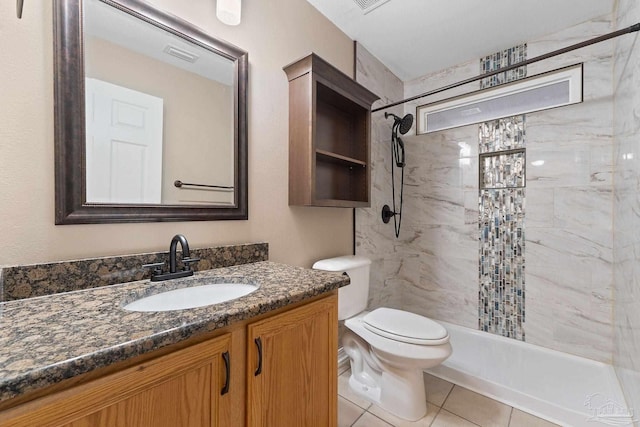 full bathroom with tile patterned floors, visible vents, toilet, a tile shower, and vanity