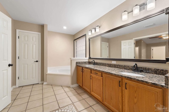 bathroom with a sink, visible vents, a garden tub, and tile patterned flooring