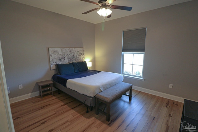 bedroom featuring ceiling fan and hardwood / wood-style flooring