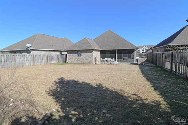 view of yard with a sunroom