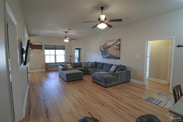 living room with ceiling fan and light wood-type flooring