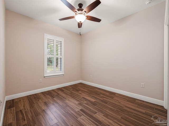 spare room with ceiling fan and dark hardwood / wood-style floors