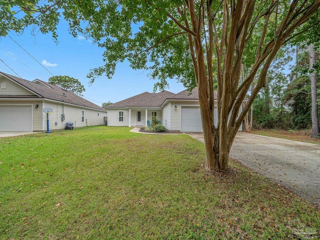 single story home featuring a garage and a front yard