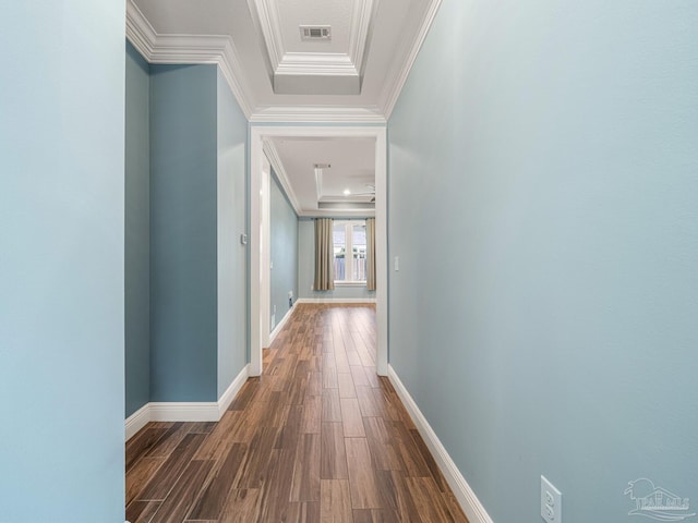 corridor featuring ornamental molding and dark hardwood / wood-style flooring