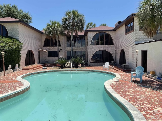 view of pool featuring a patio