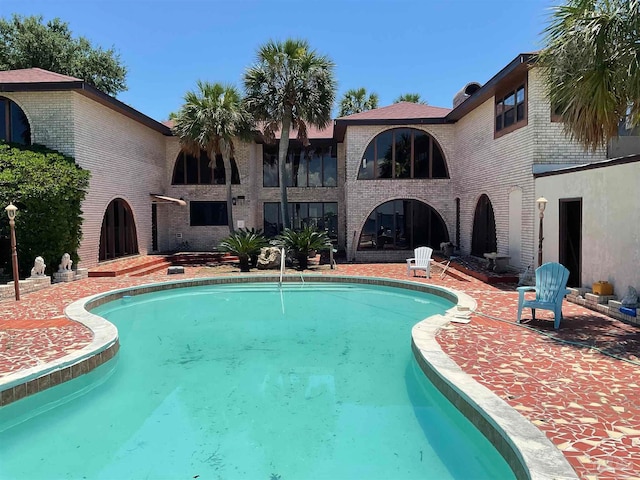 view of pool featuring a patio