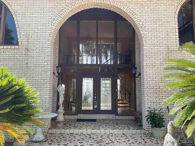 view of exterior entry featuring french doors