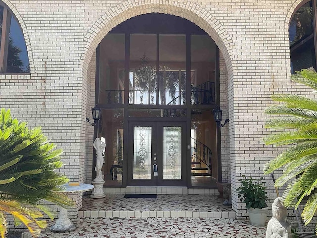 property entrance featuring french doors