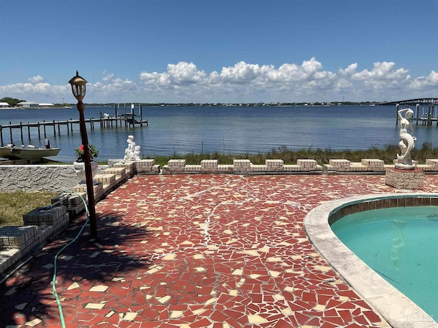 exterior space featuring a water view and a dock