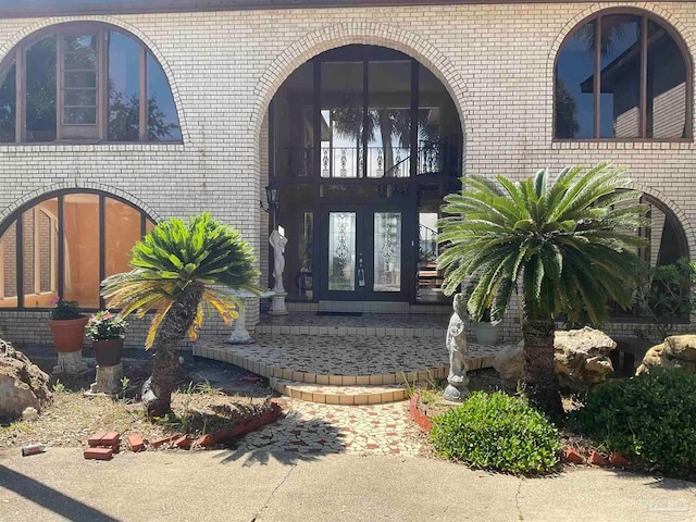 view of exterior entry featuring french doors