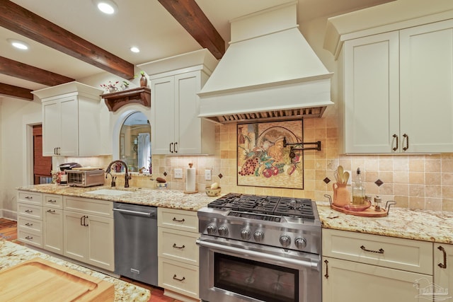 kitchen featuring sink, stainless steel appliances, light stone counters, custom exhaust hood, and beamed ceiling