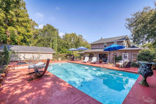 view of pool featuring a patio