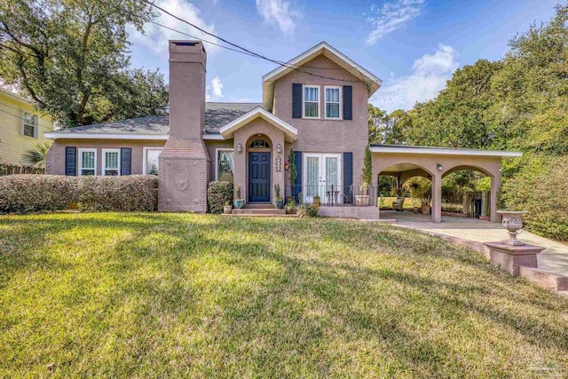 view of front of home featuring a front yard and french doors