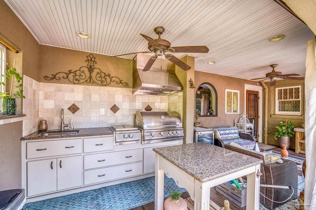 view of patio featuring sink, ceiling fan, a grill, and an outdoor kitchen