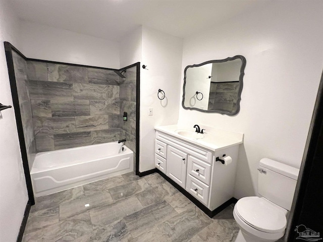 full bathroom featuring toilet, vanity, and tiled shower / bath