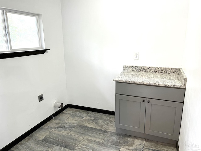 laundry area featuring cabinets and hookup for an electric dryer