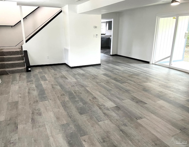 unfurnished living room featuring wood-type flooring