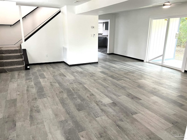 unfurnished living room featuring wood-type flooring